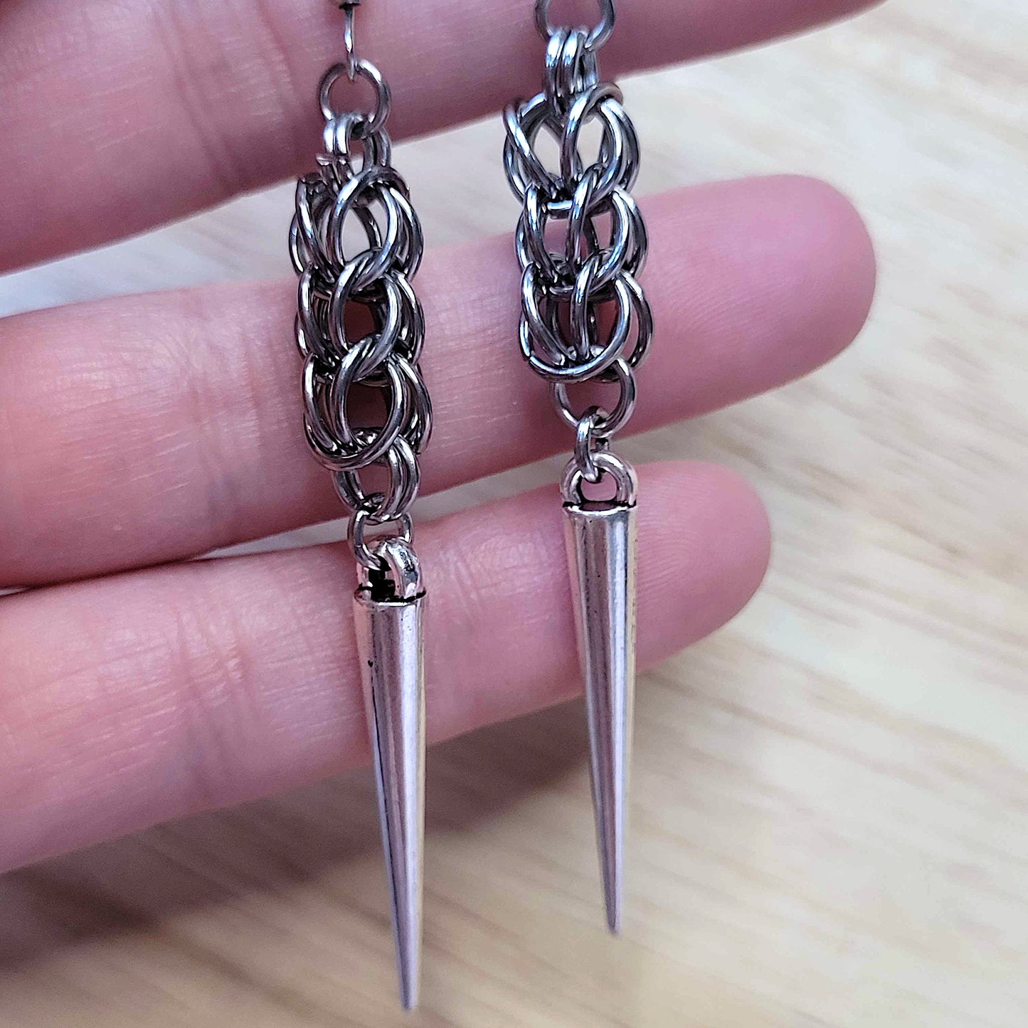 Full persian weave spike earrings