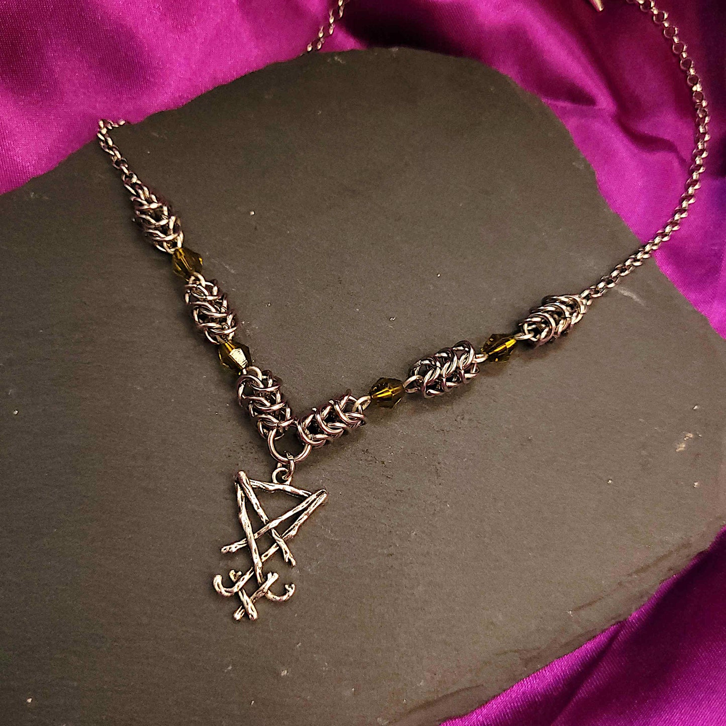 Box weave and green bead Sigil of Lucifer necklace