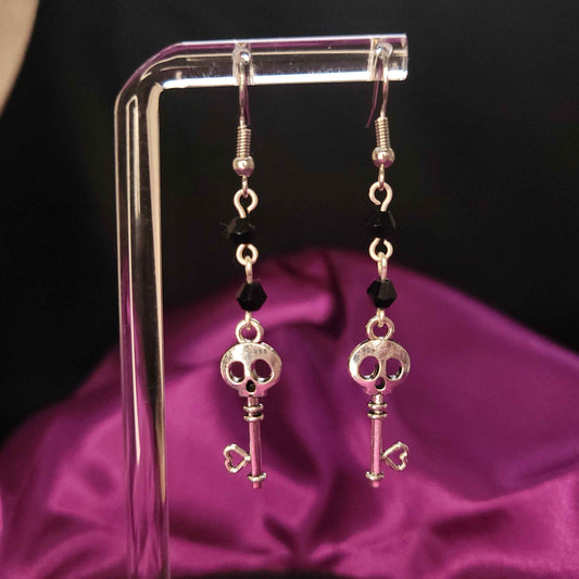 Skull key and black bead drop earrings