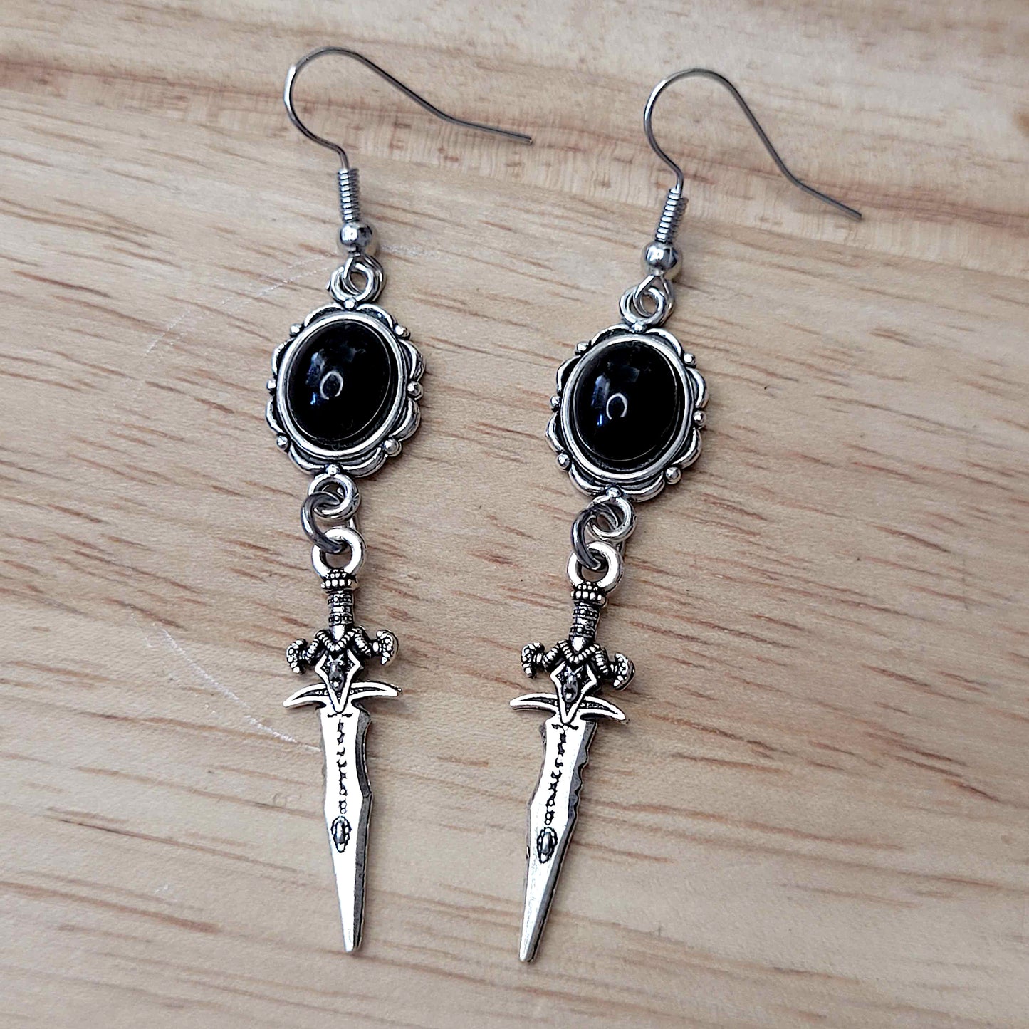 Gothic black cabochon and decorative dagger charm earrings