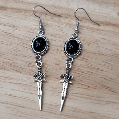 Gothic black cabochon and decorative dagger charm earrings