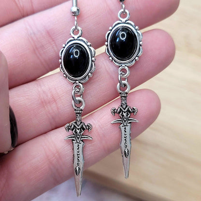 Gothic black cabochon and decorative dagger charm earrings