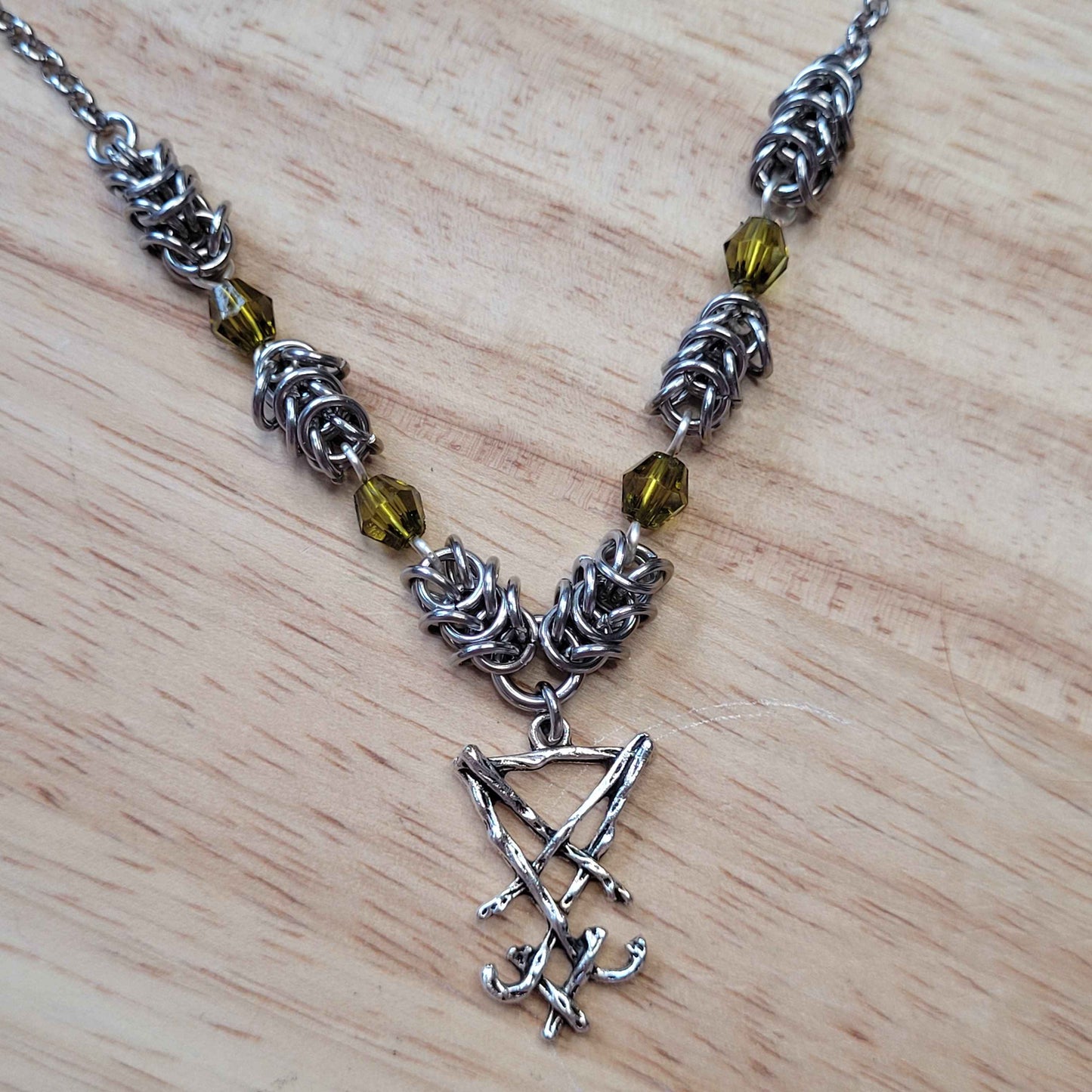 Box weave and green bead Sigil of Lucifer necklace