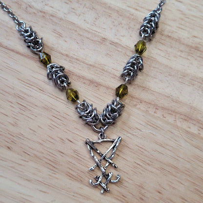 Box weave and green bead Sigil of Lucifer necklace