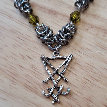 Box weave and green bead Sigil of Lucifer necklace
