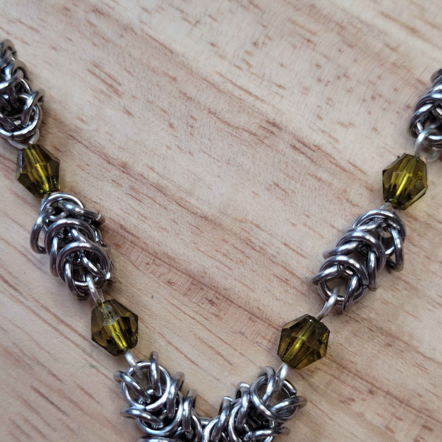 Box weave and green bead Sigil of Lucifer necklace