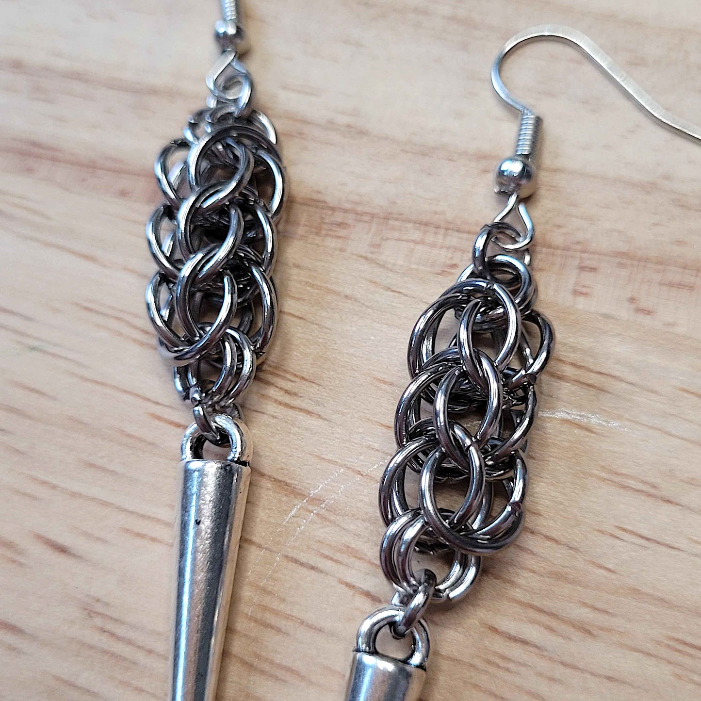 Full persian weave spike earrings