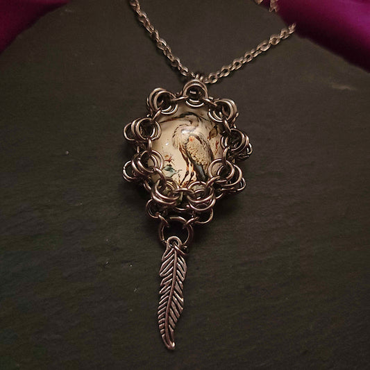 Wrapped heron cabochon and feather pendant necklace