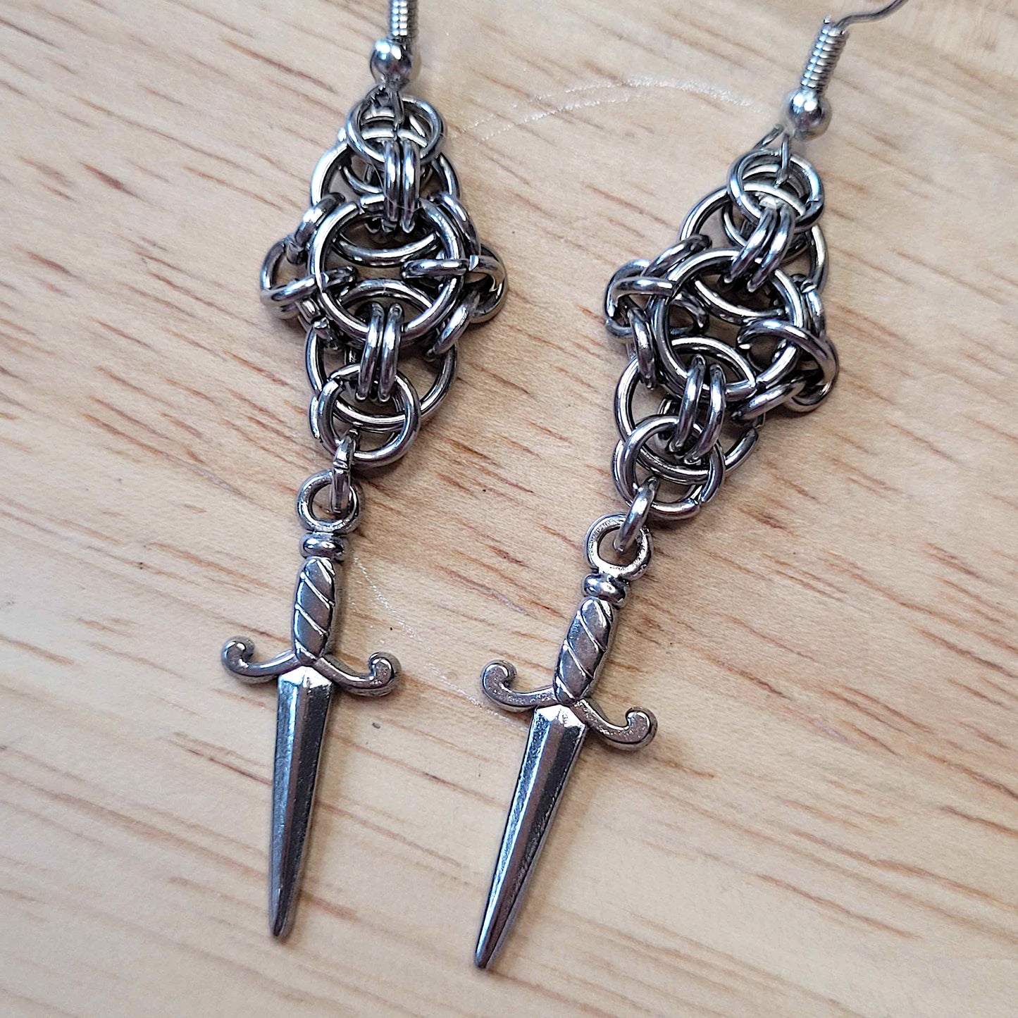 New dawn dagger earrings