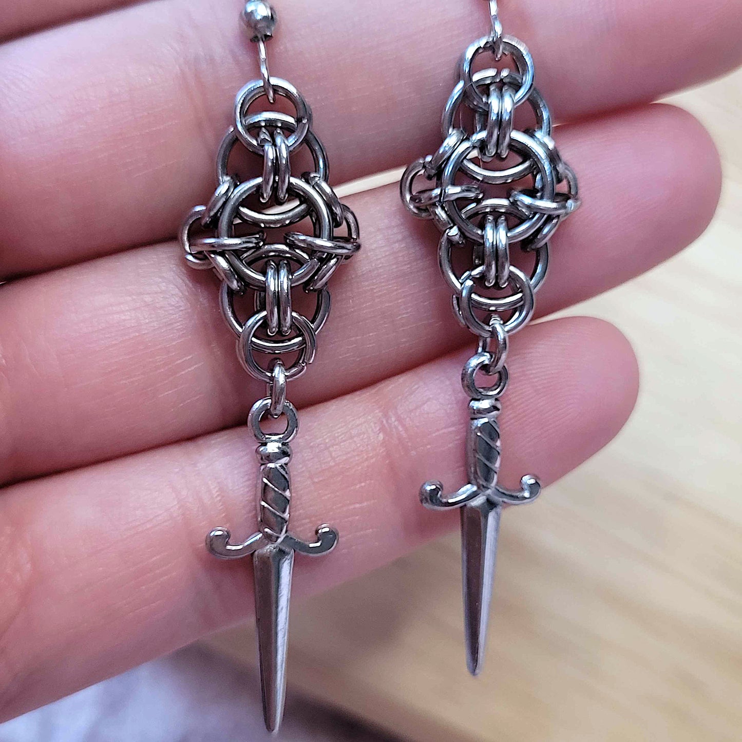 New dawn dagger earrings