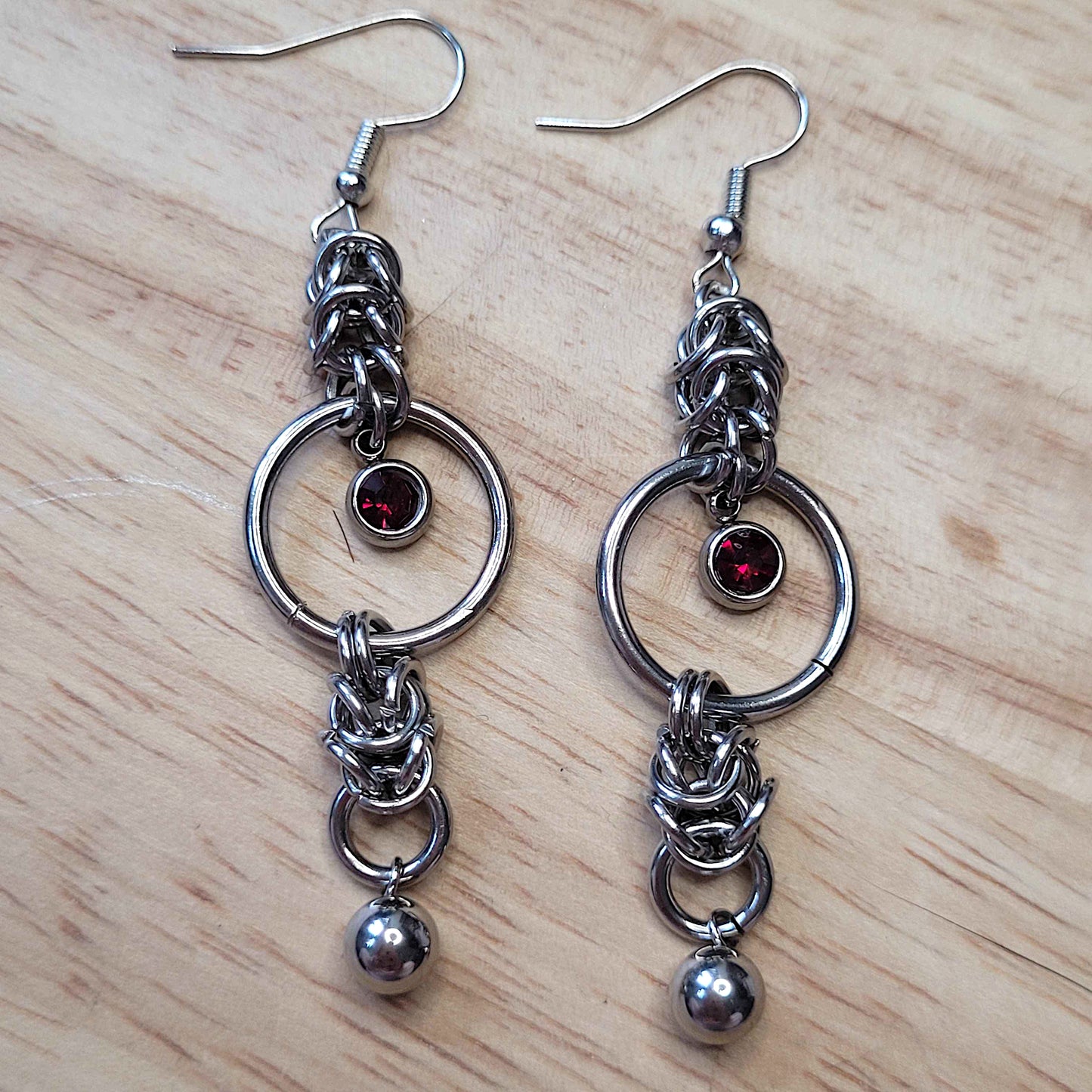Mid loop red gem and ball earrings
